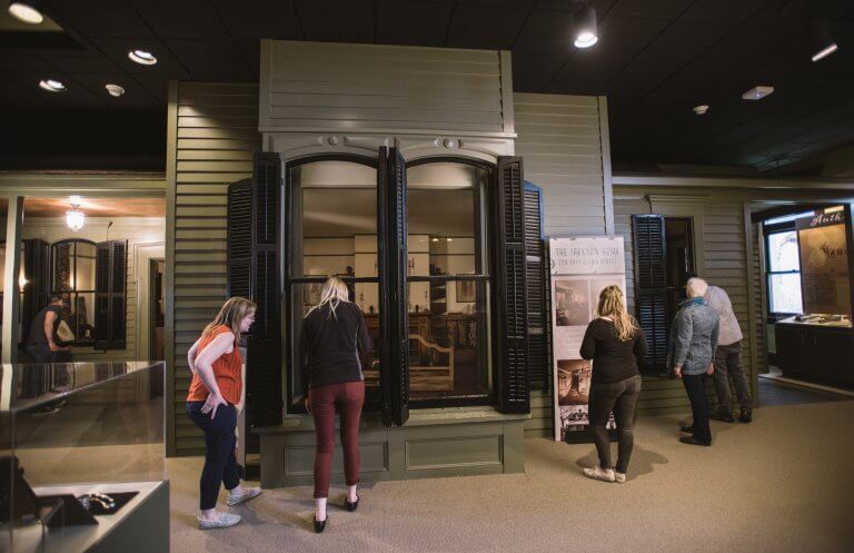 Visitors exploring the "A Home of One's Own: The Life of Helen Hunt Jackson" exhibit at the CSPM.