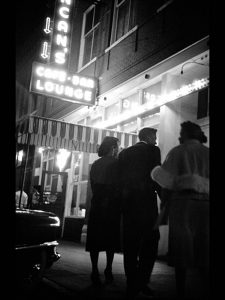 Fannie Mae Duncan with friends at entrance of Duncan's Cafe, photograph by Lew Tilley, 1958. Generously donated by Lew Tilley, S995.333.