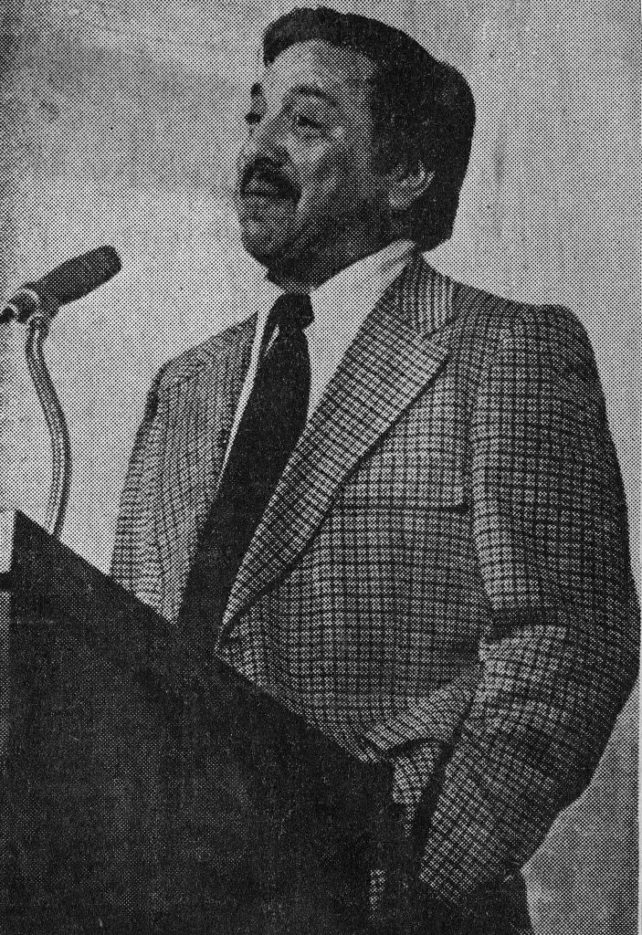 Luis Cortez speaks into a microphone at a lectern.