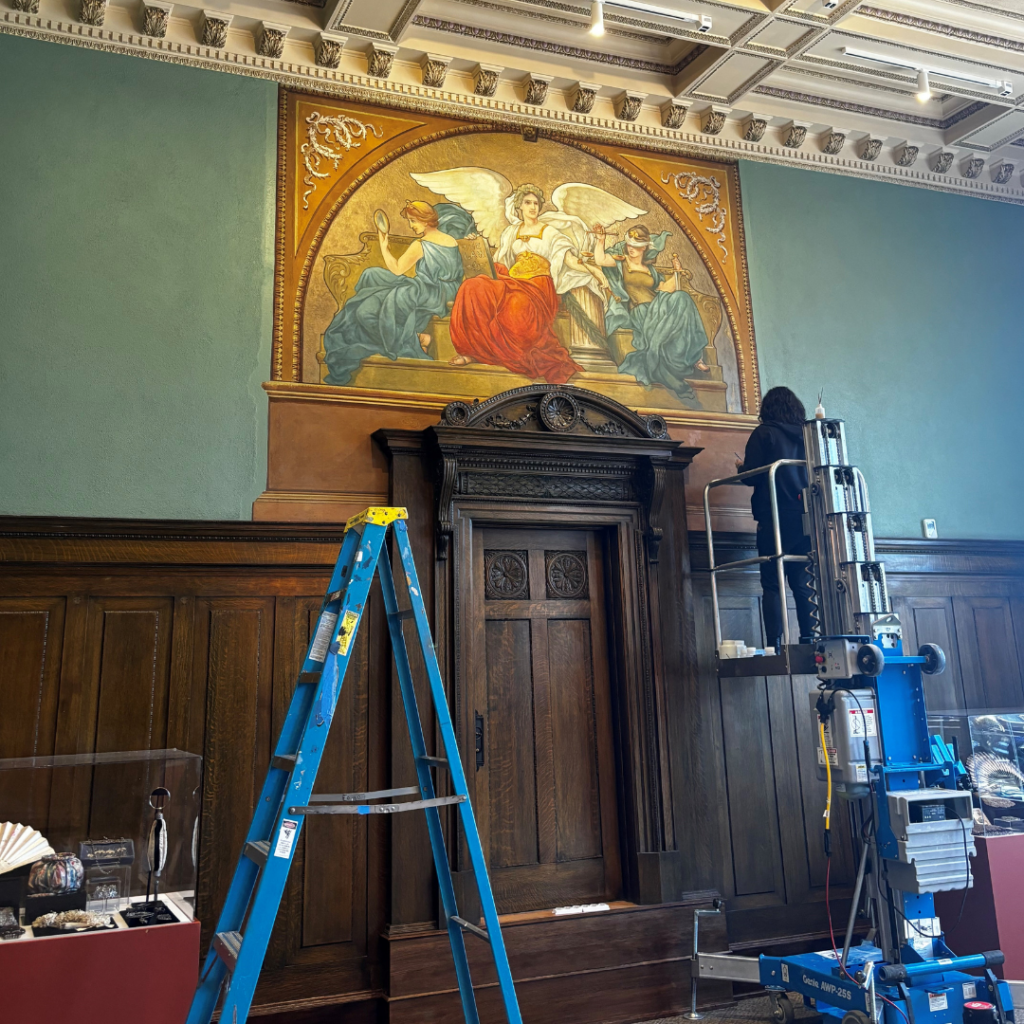Conservators working on Division III Courtroom mural.