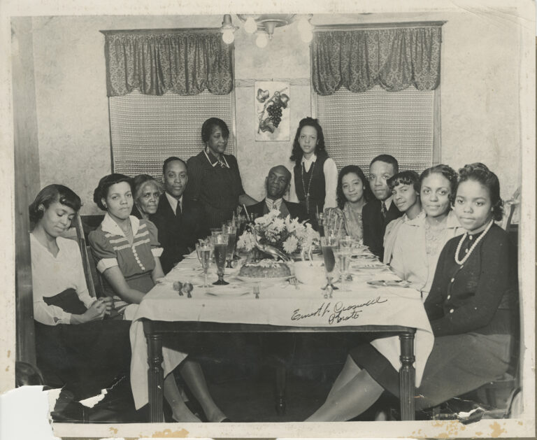 Members of the Stroud Family sit around the dinner table, ca. 1940