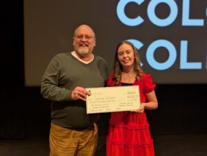 CSPM Director Matt Mayberry and Sprague Scholarship Sydney Gollihare pose for a photo after announcing her selection.