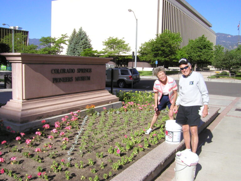 Marcia and Harry Gautsche planting flowers in Alamo Square Park as part of the Springs in Bloom program.