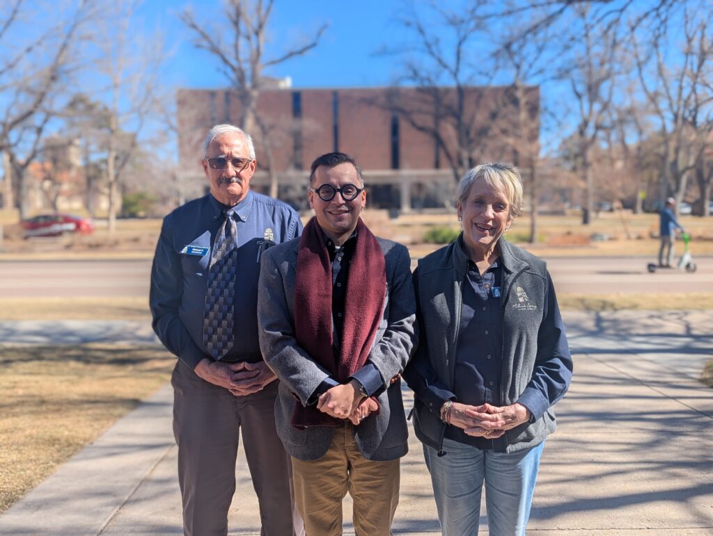 Our volunteer scholarship committee, José Antonio Arellano, Michael Caramia, and Susan Conde stand outside on the Colorado College campus.