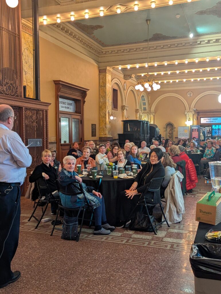 Over 40 volunteers listen to Matt Mayberry's speech at the annual appreciation breakfast.