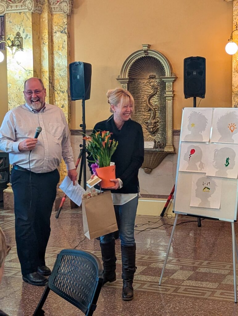 Matt Mayberry presents the Volunteer of the Year award to Sandra Meagher.