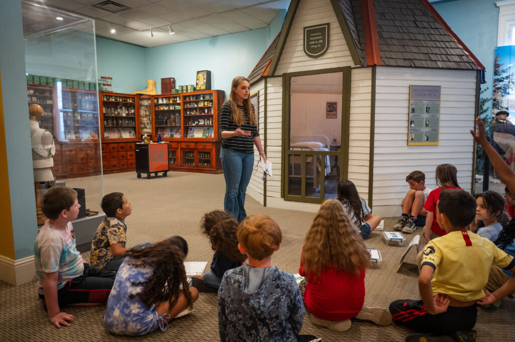 School group in the City of Sunshine exhibit, Colorado Springs Pioneers Museum.