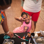Child creating art at the CSPM's Grand Reopening Family Fun Day, Colorado Springs Pioneers Museum.