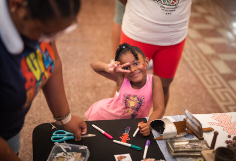 Child creating art at the CSPM's Grand Reopening Family Fun Day, Colorado Springs Pioneers Museum.