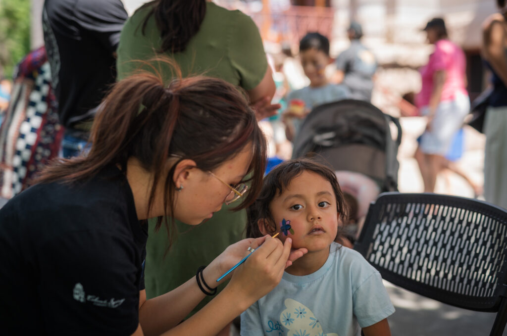 A junior docent at the face painting station.