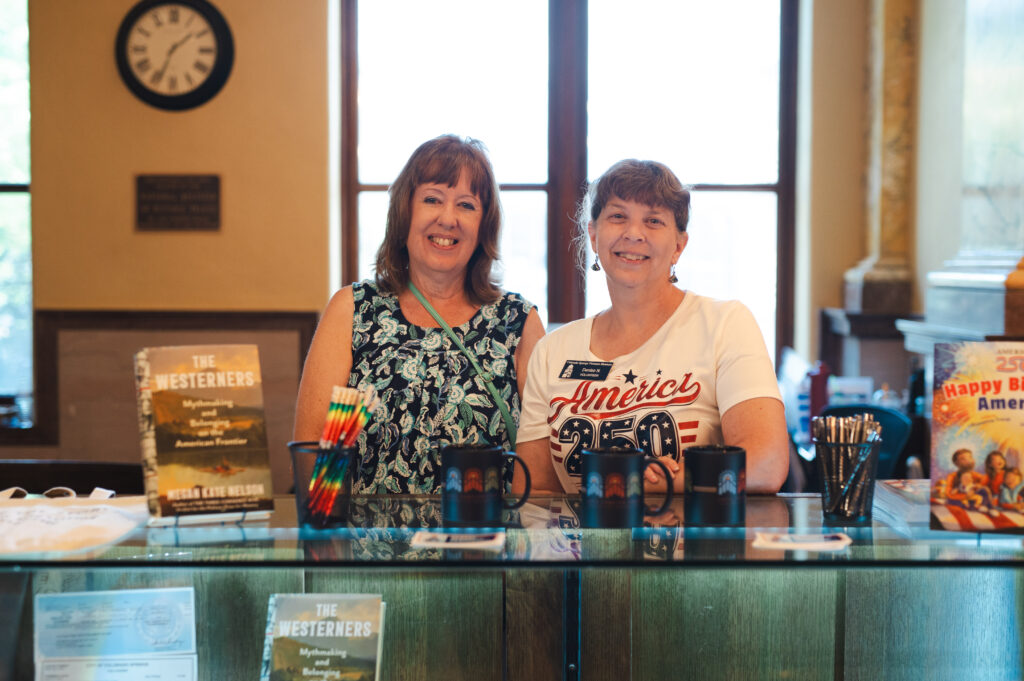 CSPM Board Member Holly Taylor and CSPM Fundraising Committee Member Denise Noble supporting the front desk at the Museum during Colorado Day.