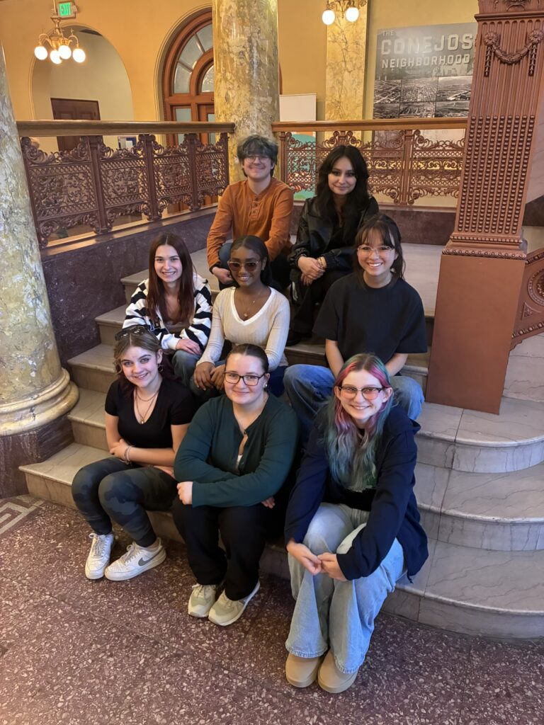 2026 junior docent class posing on the stairs.